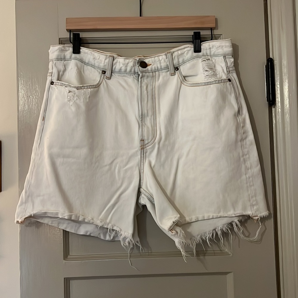 THE GREAT. Light Wash Jean Shorts with Frayed Hem